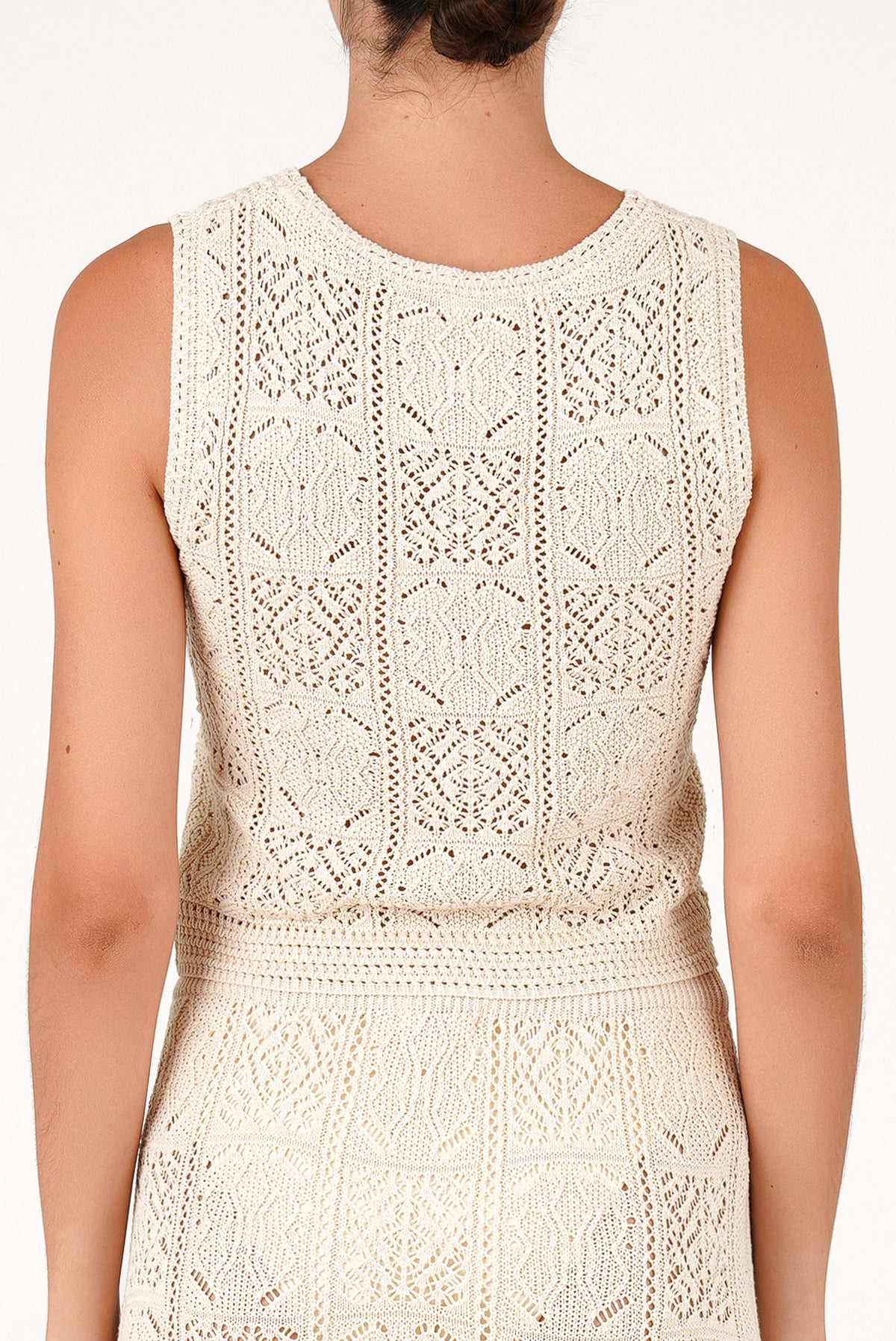 Off-white sleeveless open-knit top